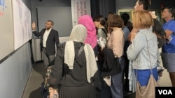 VOA Public Affairs Specialist Nigel Gibbs guides visitors during one of the agency's regular studio tours. 