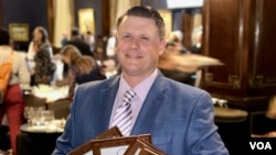 VOA Midwest correspondent Kane Farabaugh accepted four awards at the 2024 Peter Lisagor Awards held on May 10 in Chicago, Illinois. 