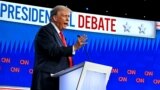 US President Joe Biden and former US President and Republican presidential candidate Donald Trump participate in the first presidential debate of the 2024 elections at CNN's studios in Atlanta, Georgia, on June 27, 2024. (Photo by ANDREW CABALLERO-REYNOLD