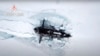 资料图：俄罗斯一艘潜艇在北极地区参与演习。