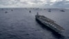 (FILE) Navy ships assemble to form the multinational fleet for a group off the coast of Hawaii during the Rim of Pacific (RIMPAC) exercise on July 26, 2018.