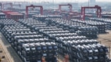 资料照：中国江苏省苏州市太仓港的国际集装箱码头堆放着等待装船出口的比亚迪电动车。(2024年2月8日）