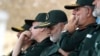 Gen. Qassem Soleimani, center, who heads the elite Quds Force of Iran's Revolutionary Guard attends a graduation ceremony of a group of the guard's officers in Tehran, Iran, June 30, 2018.