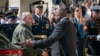 Defense Secretary Lloyd Austin, right, greets Ukraine's Defense Minister Rustem Umerov during an arrival ceremony at the Pentagon, Tuesday, July 2, 2024.