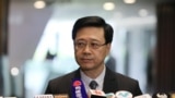 香港保安局局长李家超2019年10月23日在立法会宣布撤回逃犯条例修订草案。