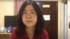 (FILE )This file screengrab taken on Dec. 28, 2020 from an undated video showing former Chinese lawyer and citizen journalist Zhang Zhan as she broadcasts via YouTube, at an unconfirmed location in China. 