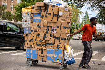 New York NY/USA-September 7, 2019 A handcart laden with deliveries, mostly Amazon, in the Soho neighborhood in New York