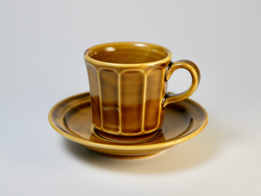 Chamfered yellow porcelain cup and saucer