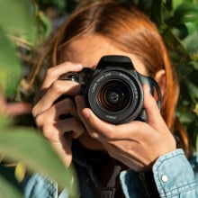 Woman taking photohraph.