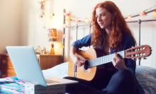 woman doing online lesson with guitar