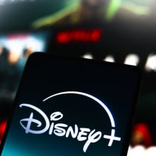 The Disney Plus logo is displayed on a smartphone screen