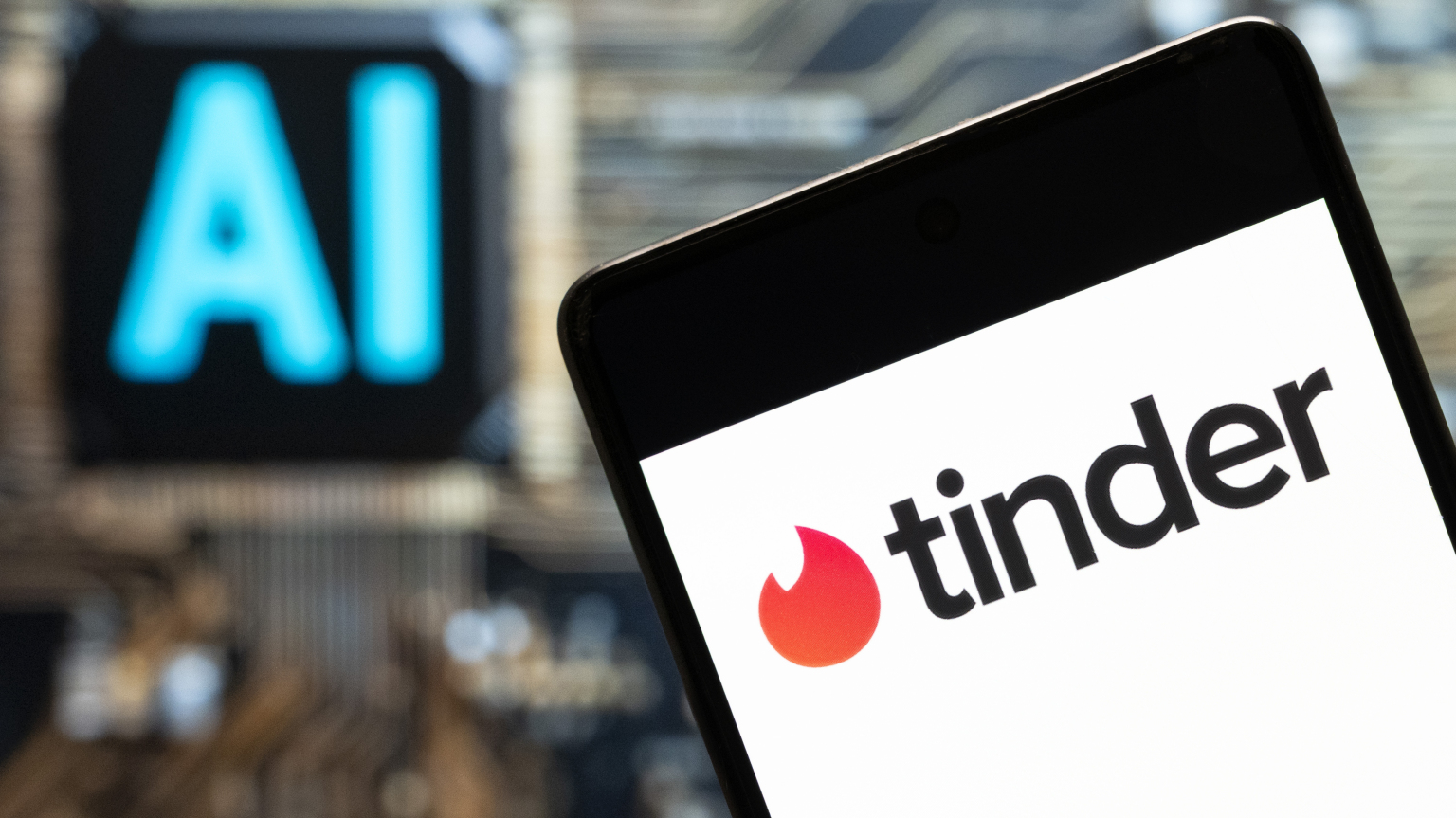 Tinder logo seen displayed on a smartphone with an Artificial intelligence (AI) chip and symbol in the background