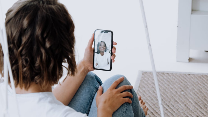 woman video calling another woman on phone