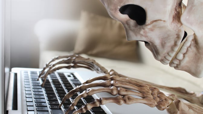 Skeleton at computer