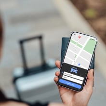 Young woman ordering taxi to the airport with smartphone. Business and leisure travel concept. Tourism and technology,