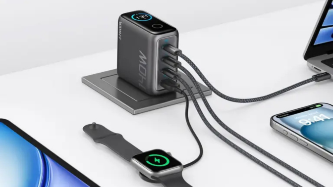 An Anker charger charging four different devices.