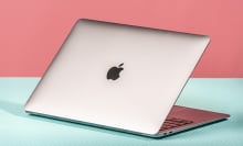 MacBook Air on pink and green background