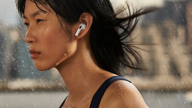 A woman jogging in Apple AirPods (third-gen).