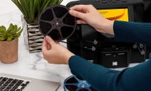 person using Kodak Reels film digitizer