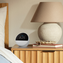 an amazon echo spot on a bedside table