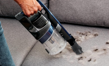 shark pet vacuum handheld cleaning a couch