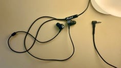 marshall headphones on deskmat next to lamp