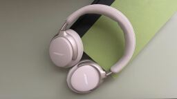 white bose qc ultra headphones on a green book