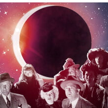 a crowd of people gawk at the eclipsed sun