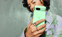 girl holding aloe google pixel 8a phone with colorful shirt and nails