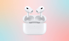 air pods pro against a pink and green background 