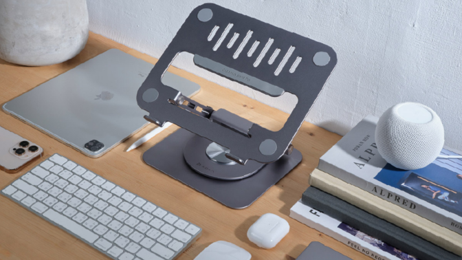 Casa Hub Stand Pro on desktop with keyboard, mouse, and other accessories