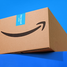 an amazon box against a bright blue background