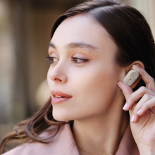 woman wearing wireless earbuds