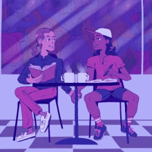 two people sitting in a coffee shop