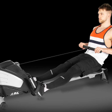 Man on rowing machine