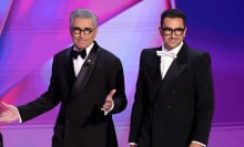 Hosts Eugene Levy and Dan Levy speak onstage during the 76th Primetime Emmy Awards at Peacock Theater 