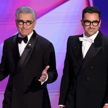 Hosts Eugene Levy and Dan Levy speak onstage during the 76th Primetime Emmy Awards at Peacock Theater 