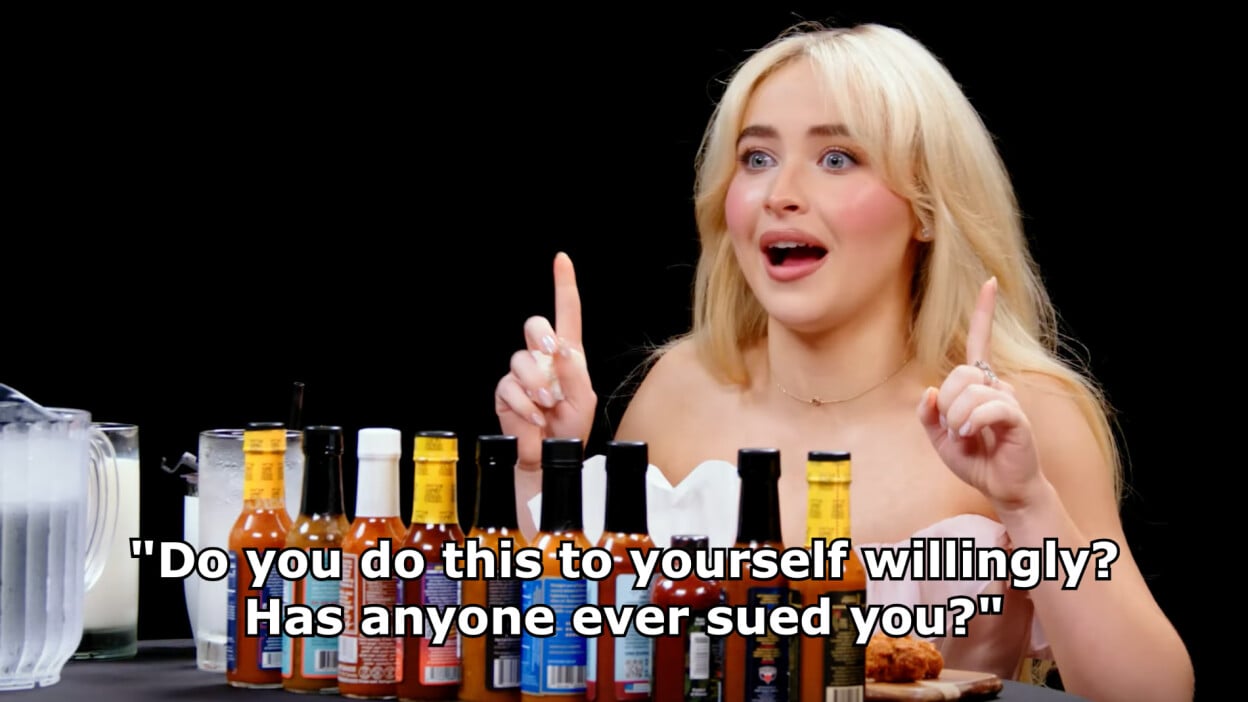 Sabrina Carpenter on "Hot Ones." A quote on the image reads: "Do you do this to yourself willingly? Has anyone ever sued you?"