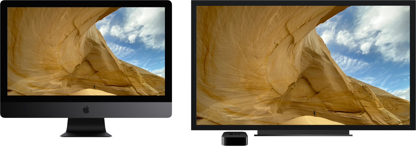 An iMac Pro with its content mirrored on a large HDTV using an Apple TV.