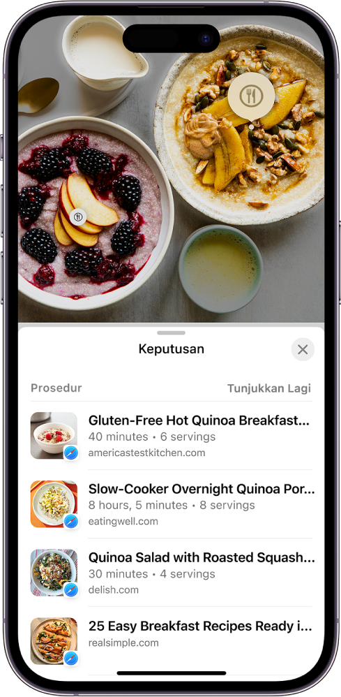 Bahagian atas skrin iPhone memaparkan foto pelbagai jenis makanan. Dua daripada item makanan dikenal pasti oleh Rujukan Visual dan satu item dipilih. Bahagian bawah skrin menunjukkan pautan Safari ke resipi serupa dengan makanan yang dikenalpasti oleh Rujukan Visual.