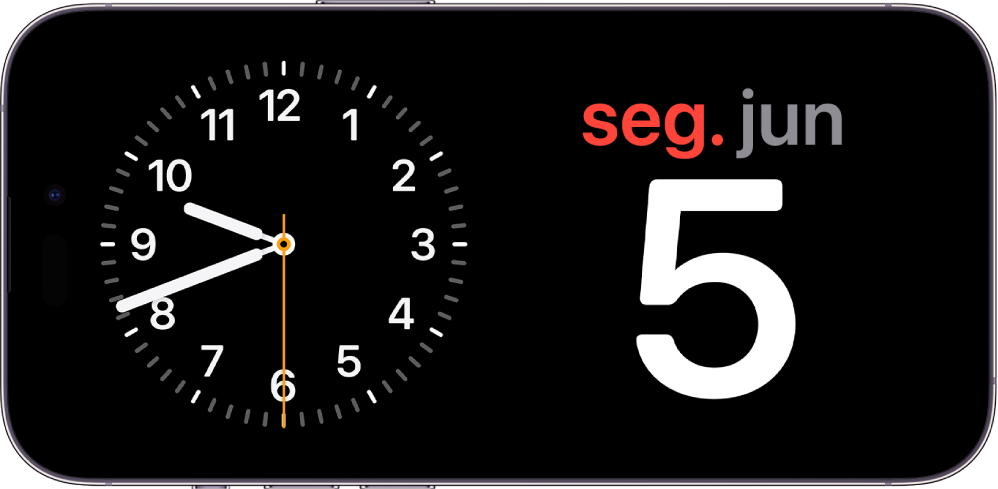 iPhone na horizontal. O lado esquerdo do ecrã apresenta um relógio e o lado direito do ecrã apresenta a data.