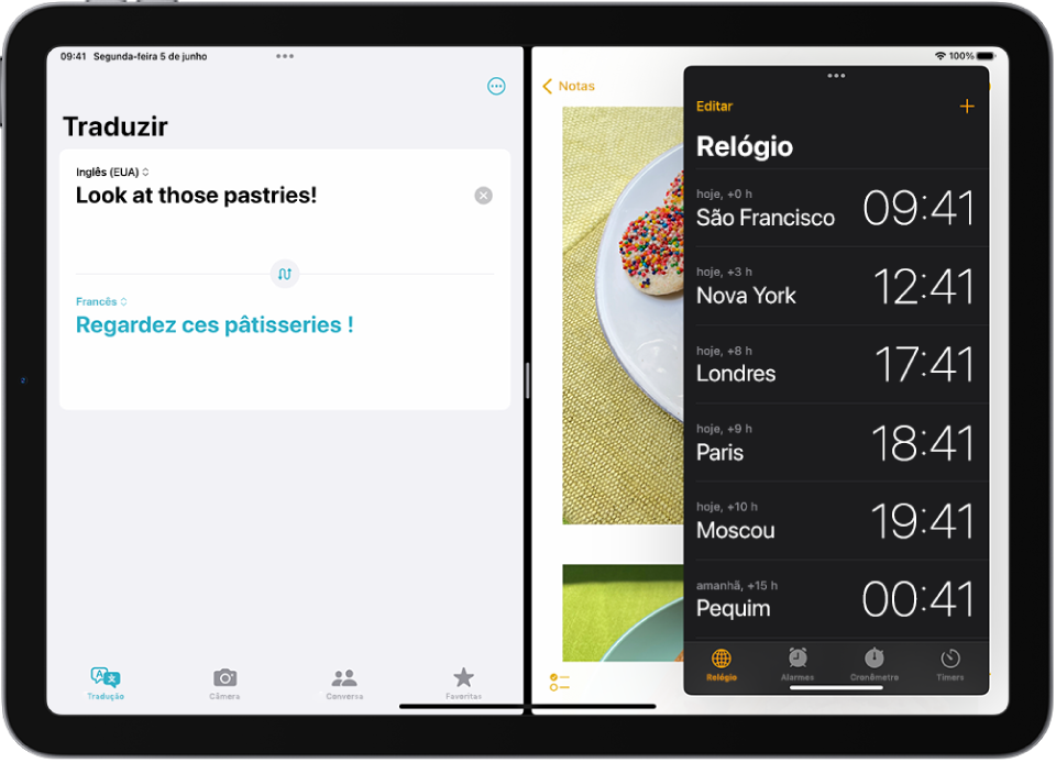 O app Traduzir está aberto no lado esquerdo da tela, o app Notas está aberto à direita e o Relógio está aberto em uma janela de Slide Over que cobre parcialmente o app Notas.