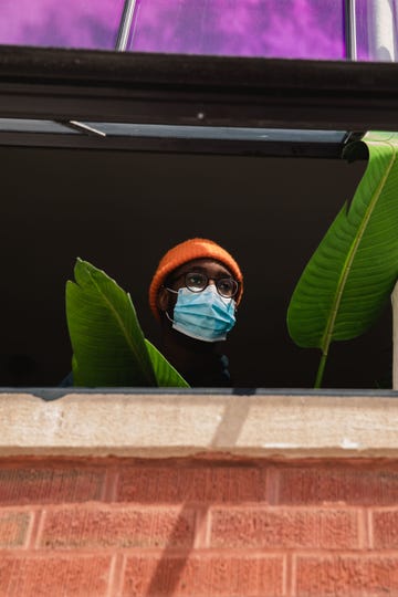 portrait of person staring out of home