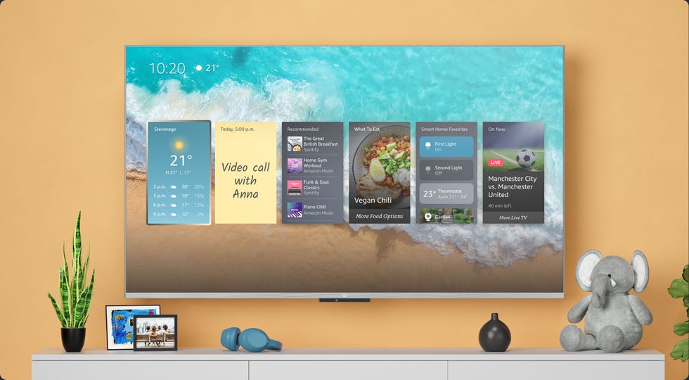 amazon fire tv omni qled on a yellow wall