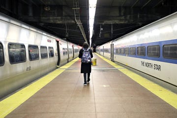 Commuters Navigate Mass Transit During Rush Hour Amid Coronavirus Threat