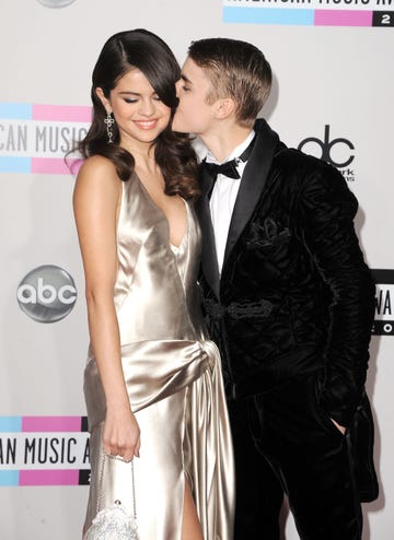 los angeles, ca november 20 l r singer selena gomez and singer justin bieber arrive at the 2011 american music awards held at nokia theatre la live on november 20, 2011 in los angeles, california photo by steve granitzwireimage