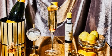 Yellow, Alcohol, Drink, Distilled beverage, Alcoholic beverage, Liqueur, Champagne, Liquid, Glass bottle, Champagne stemware, 