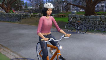 the sims 4 woman riding a bike