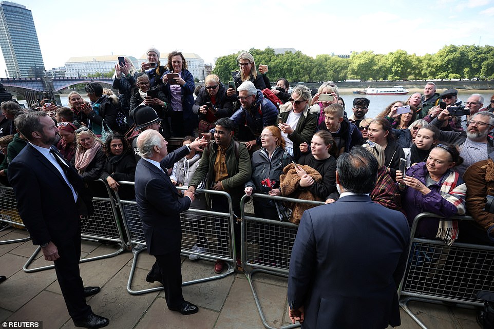 King Charles greets people queueing to pay their respects to Queen Elizabeth