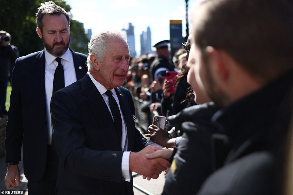 King Charles greets people queueing to pay their respects to the Queen lying-in-state at Westminster Hall